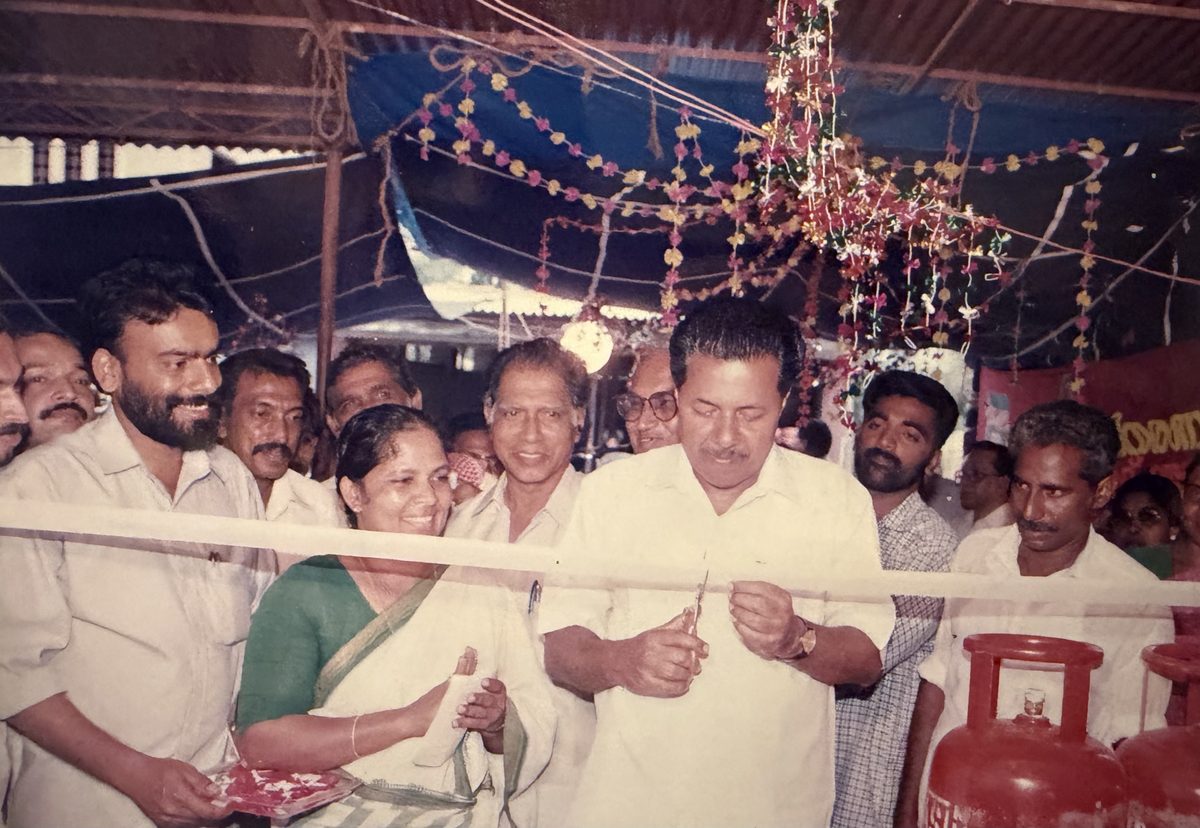 Cutting the ribbon at the opening, 1995